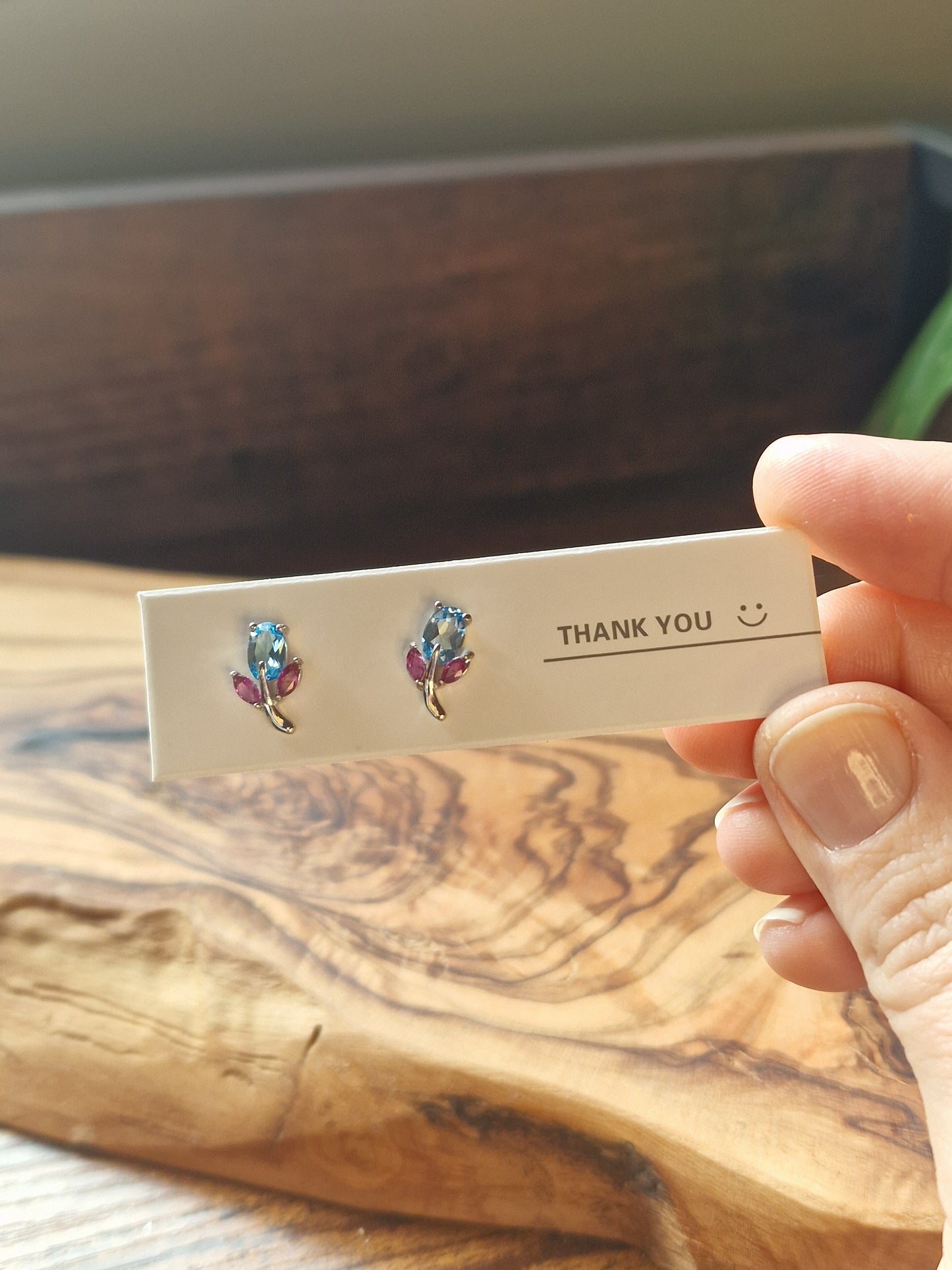 Blue Topaz & Ruby leaf studs