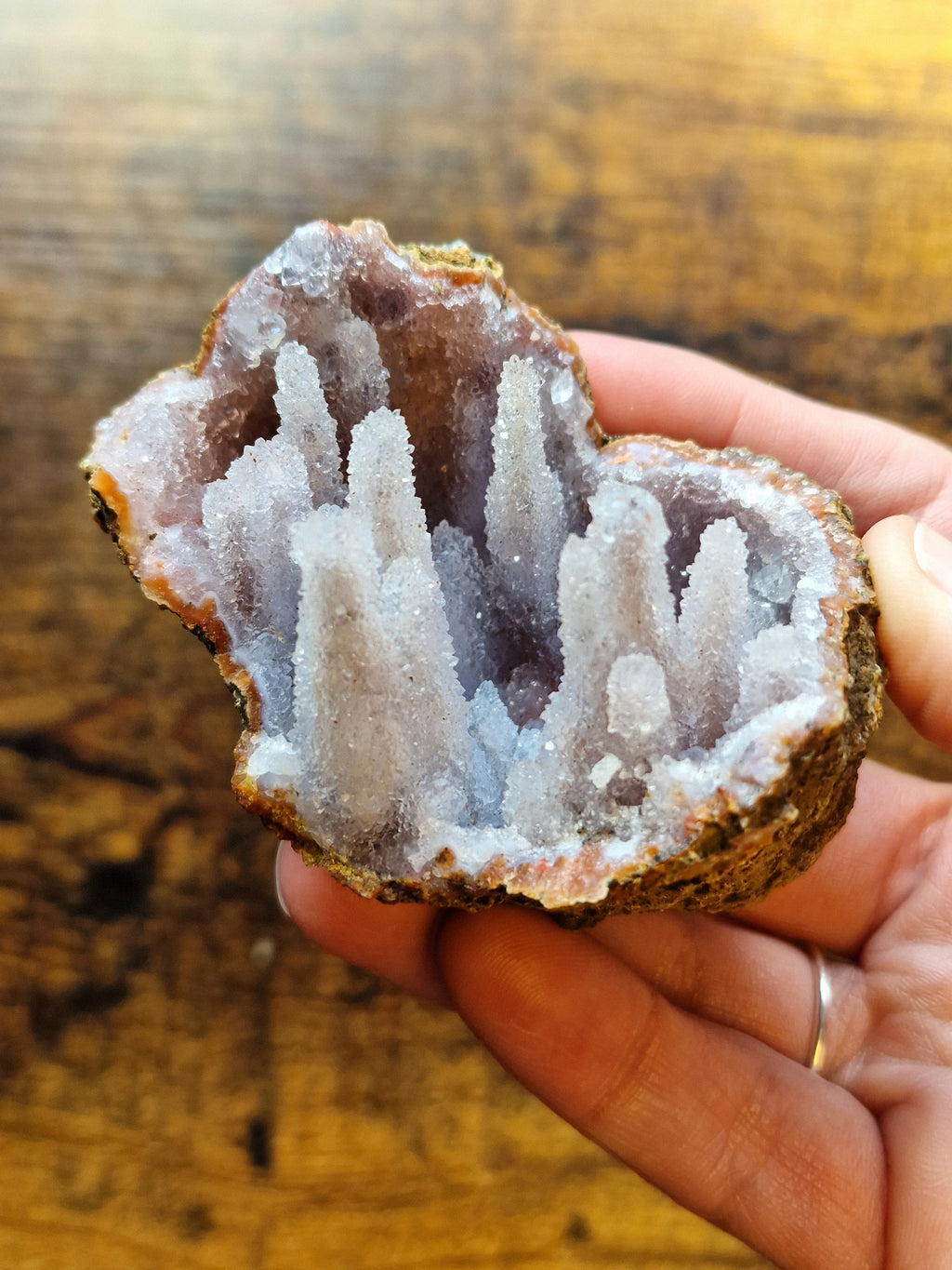 Pink Chalcedony Stalactite Formation in Display Case