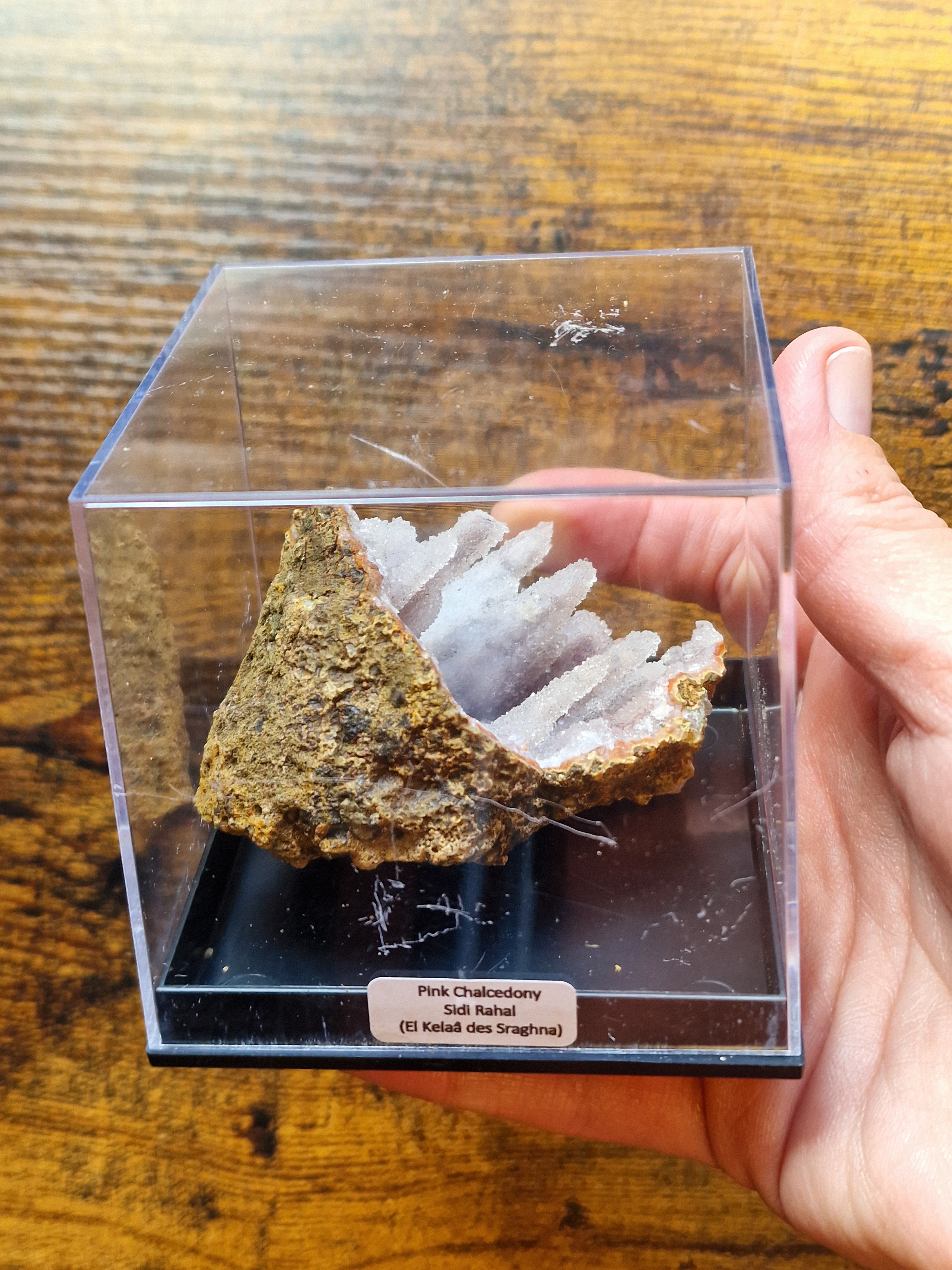 Pink Chalcedony Stalactite Formation in Display Case